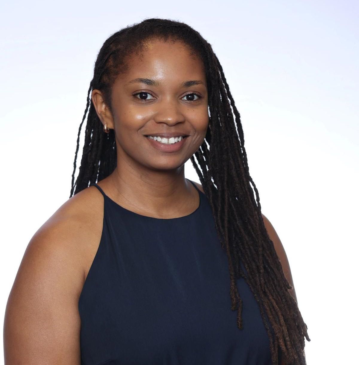 This is a headshot of Jasmyne Epps wearing a green dress.
